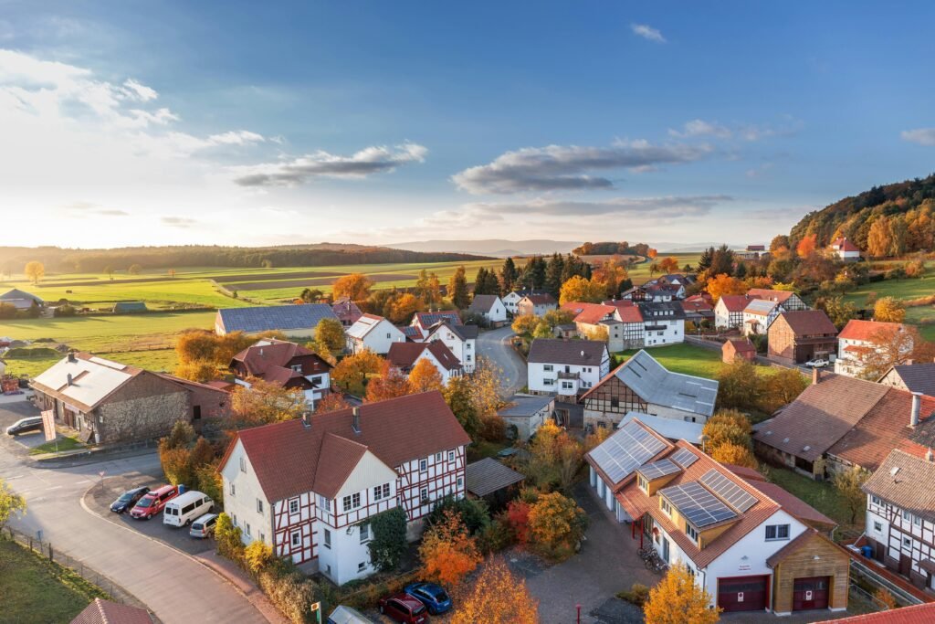 pexels photo 280221 280221 Charming aerial view of a rural village in autumn with vivid colors and clear skies.